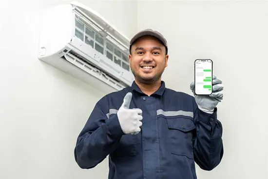 HVAC Tech Holding Phone